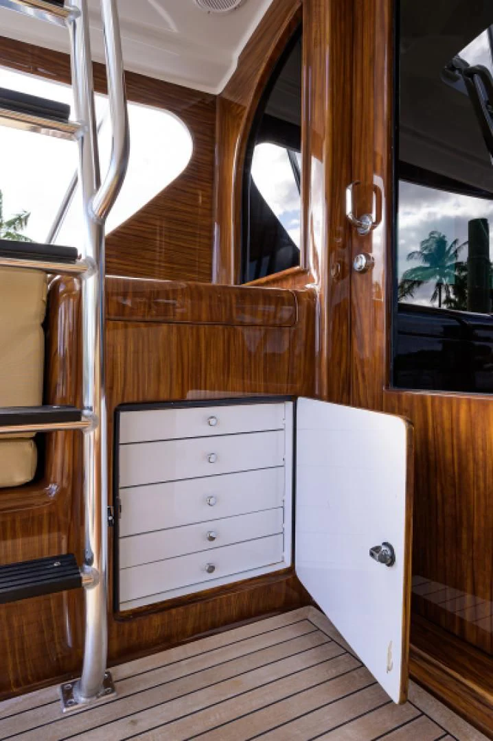 a room with a closet and a window aboard FLYING J Yacht for Sale