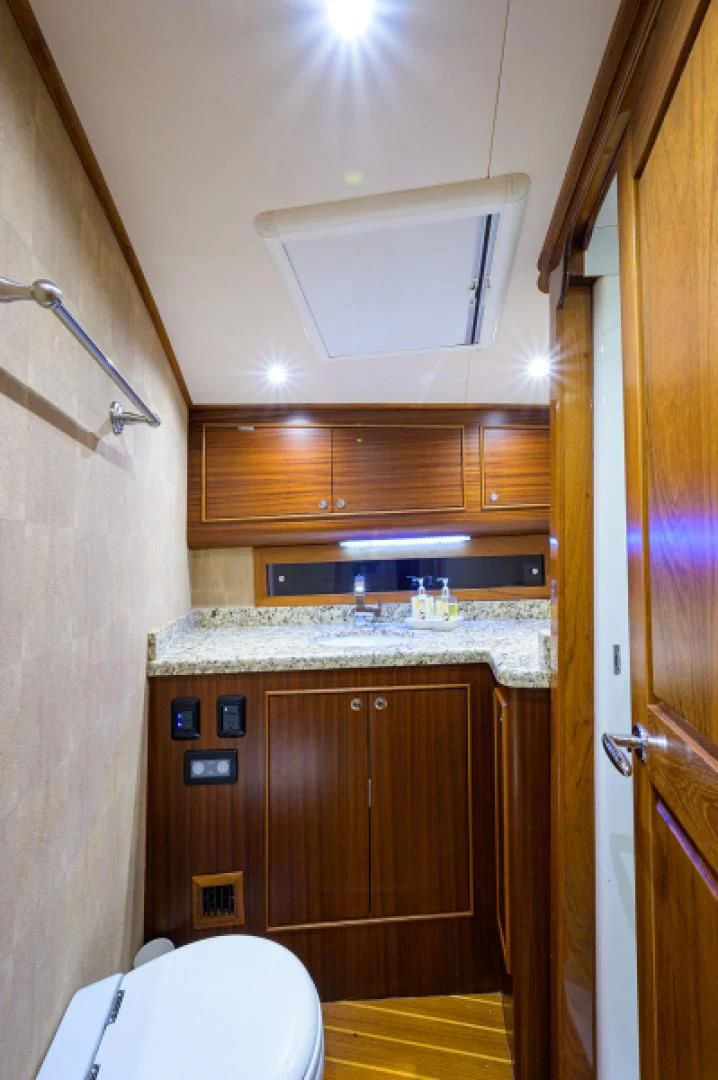 a bathroom with a sink and a toilet aboard FLYING J Yacht for Sale