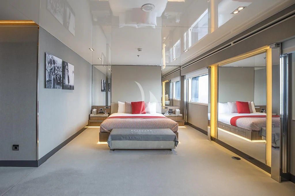 a room with a bed and a mirror aboard MARQUISE Yacht for Sale