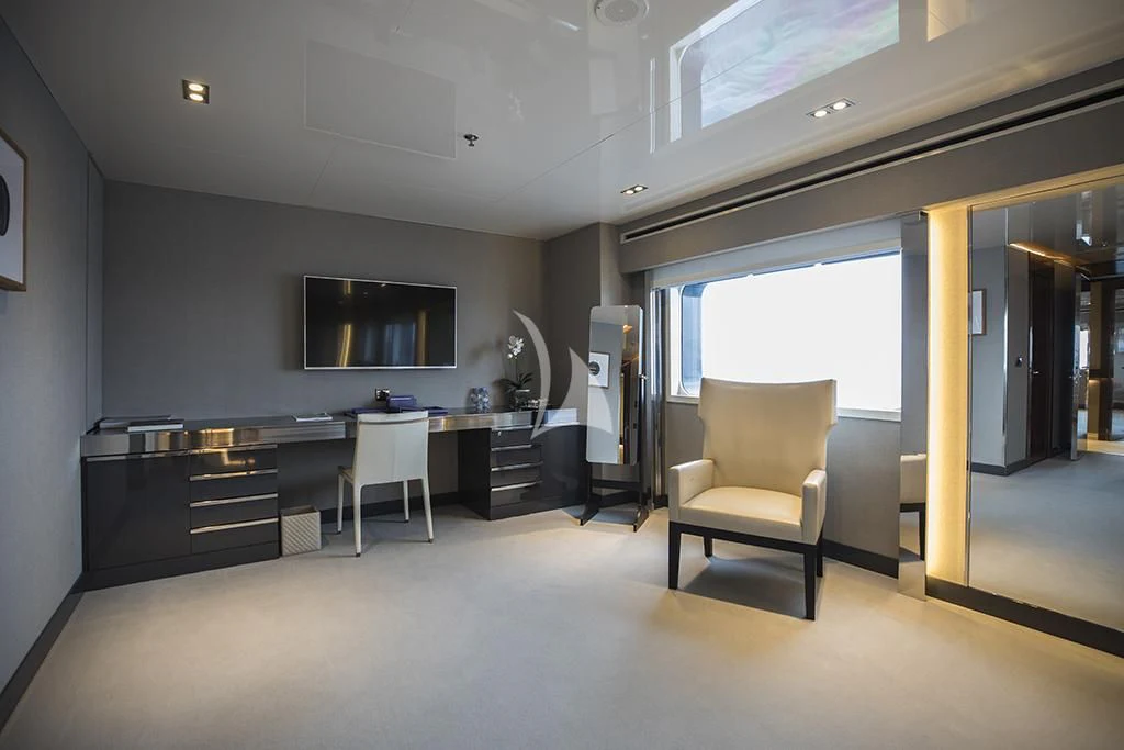 a room with a desk and chairs aboard MARQUISE Yacht for Sale