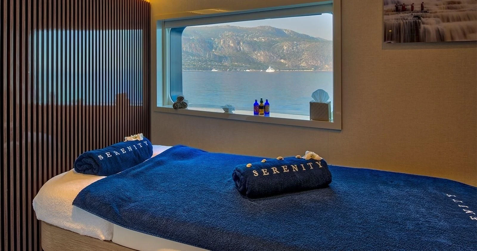 a bed with a blue pillow aboard MARQUISE Yacht for Sale
