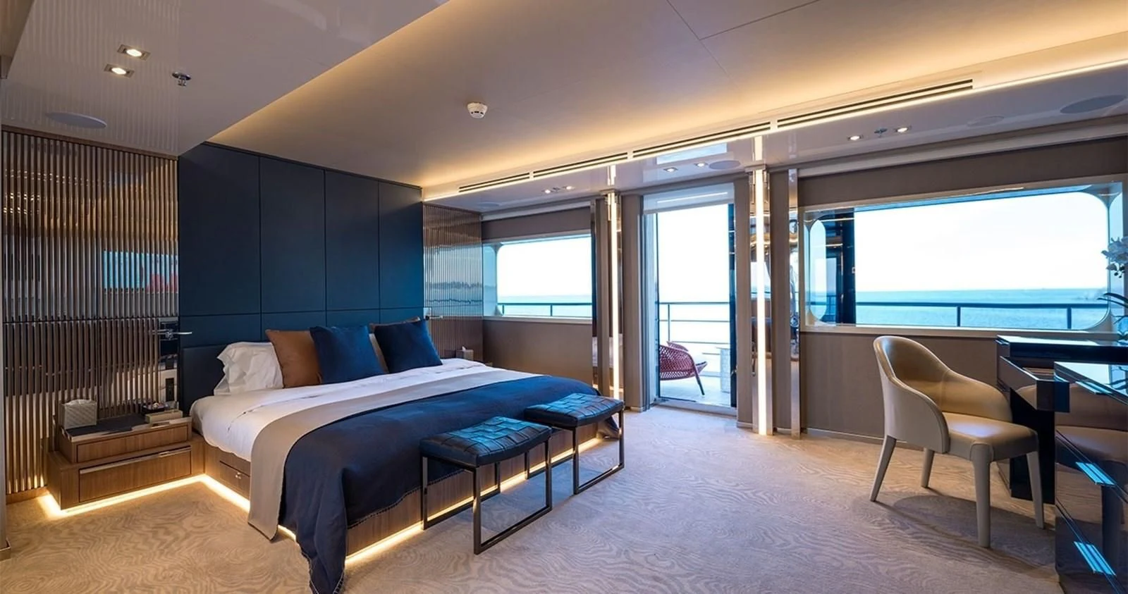 a large bedroom with a bed and a balcony aboard MARQUISE Yacht for Sale