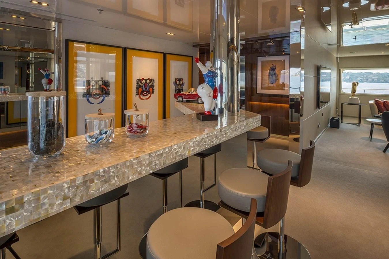 a table with chairs and a glass on it aboard MARQUISE Yacht for Sale