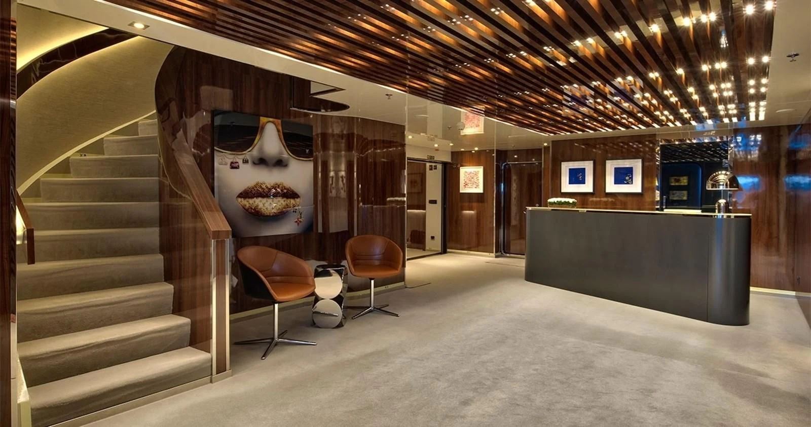 a room with a staircase and chairs aboard MARQUISE Yacht for Sale