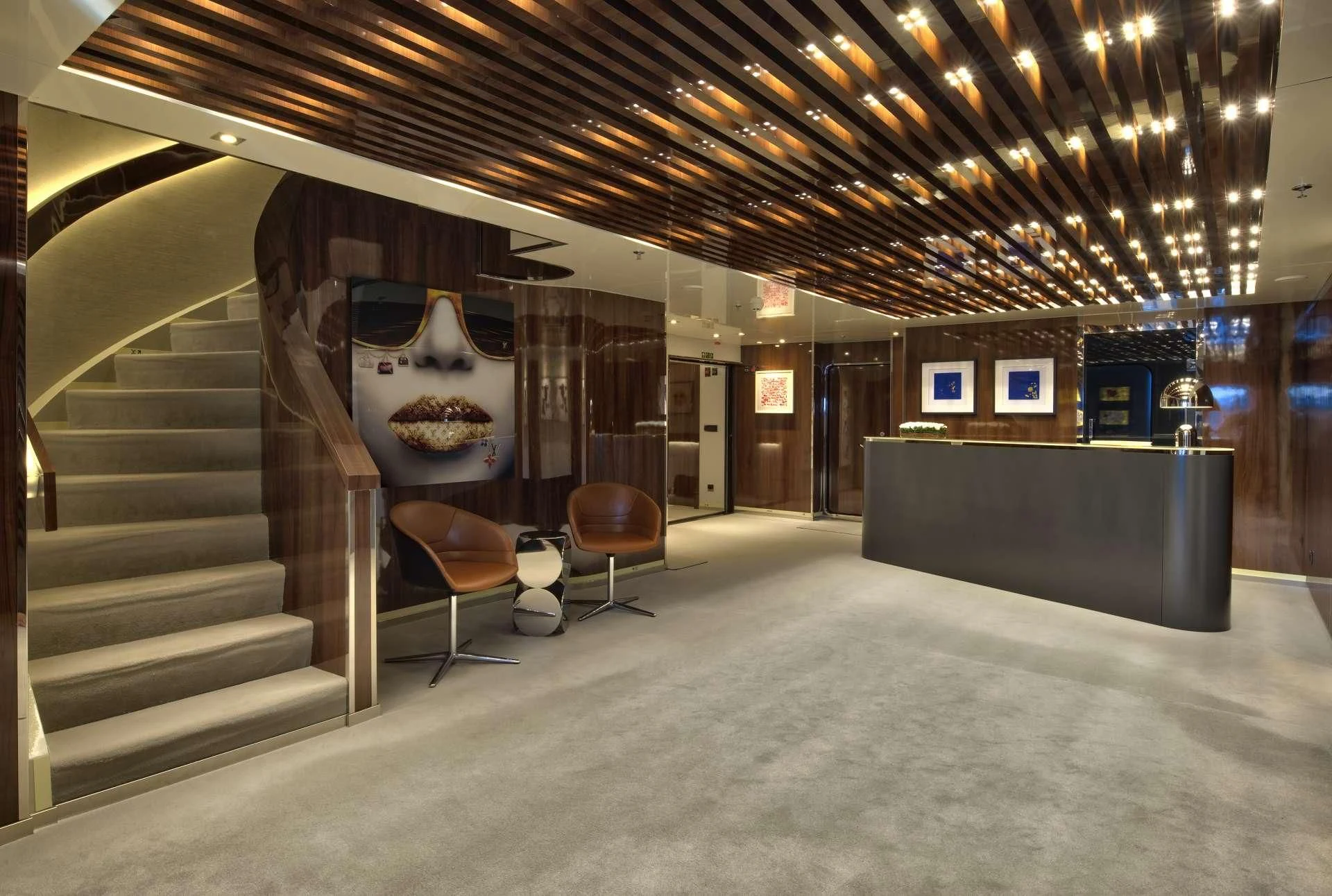 a room with a staircase and a table and chairs aboard MARQUISE Yacht for Sale
