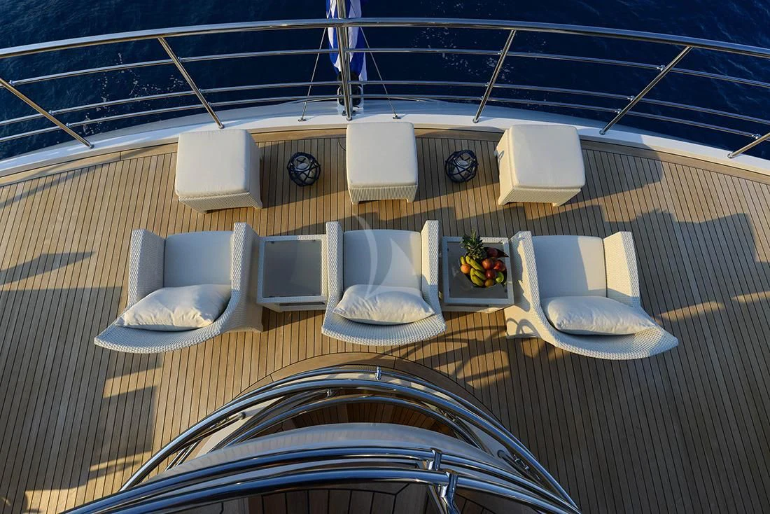 a table with chairs and a tray on it aboard MARQUISE Yacht for Sale