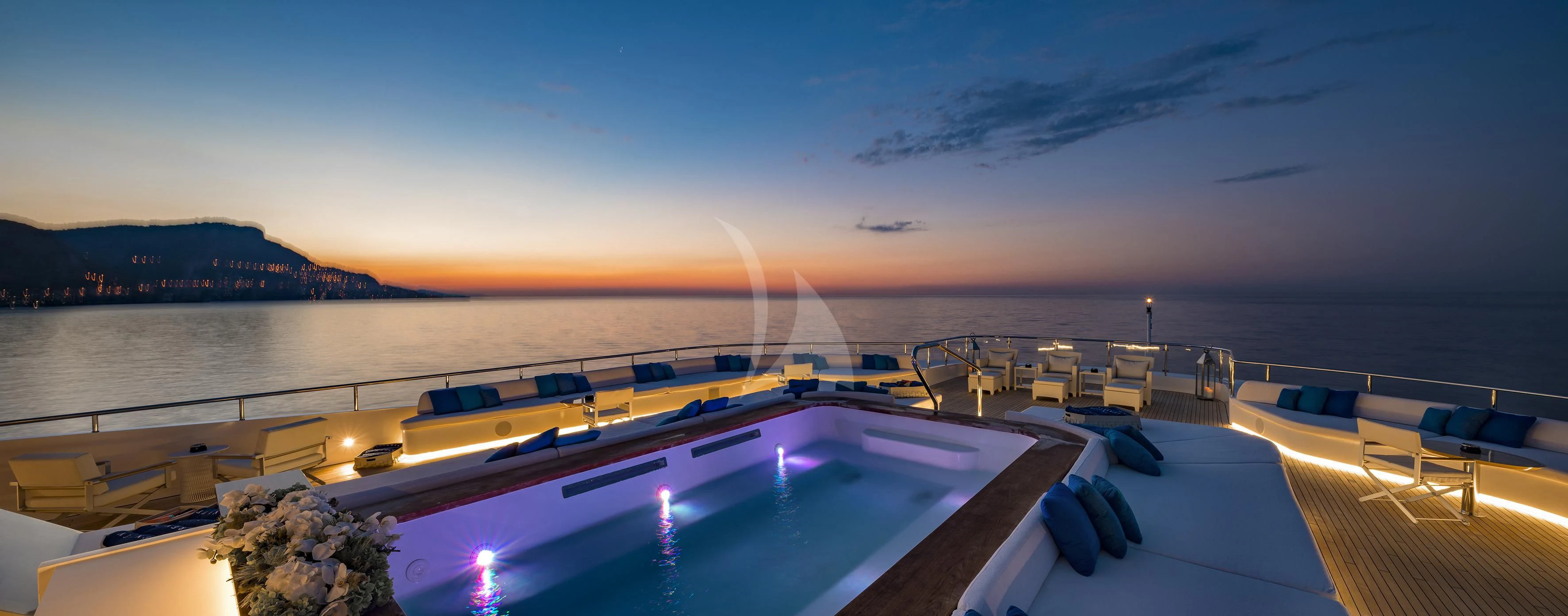 a large pool with a deck overlooking a body of water aboard MARQUISE Yacht for Sale