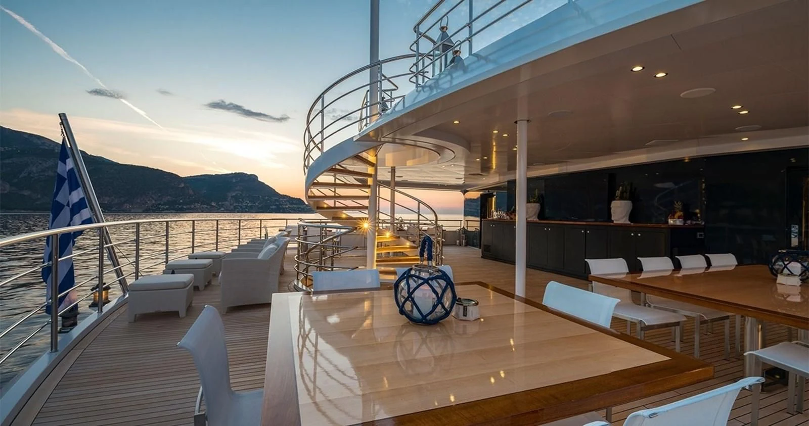 a deck with a large deck and a large boat on it aboard MARQUISE Yacht for Sale