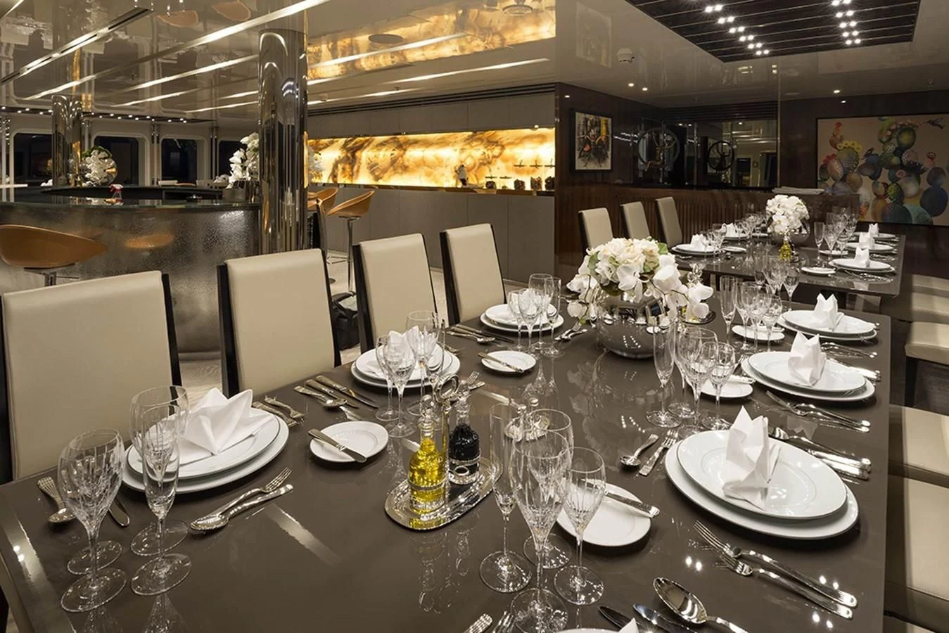 a table set with plates and glasses aboard MARQUISE Yacht for Sale
