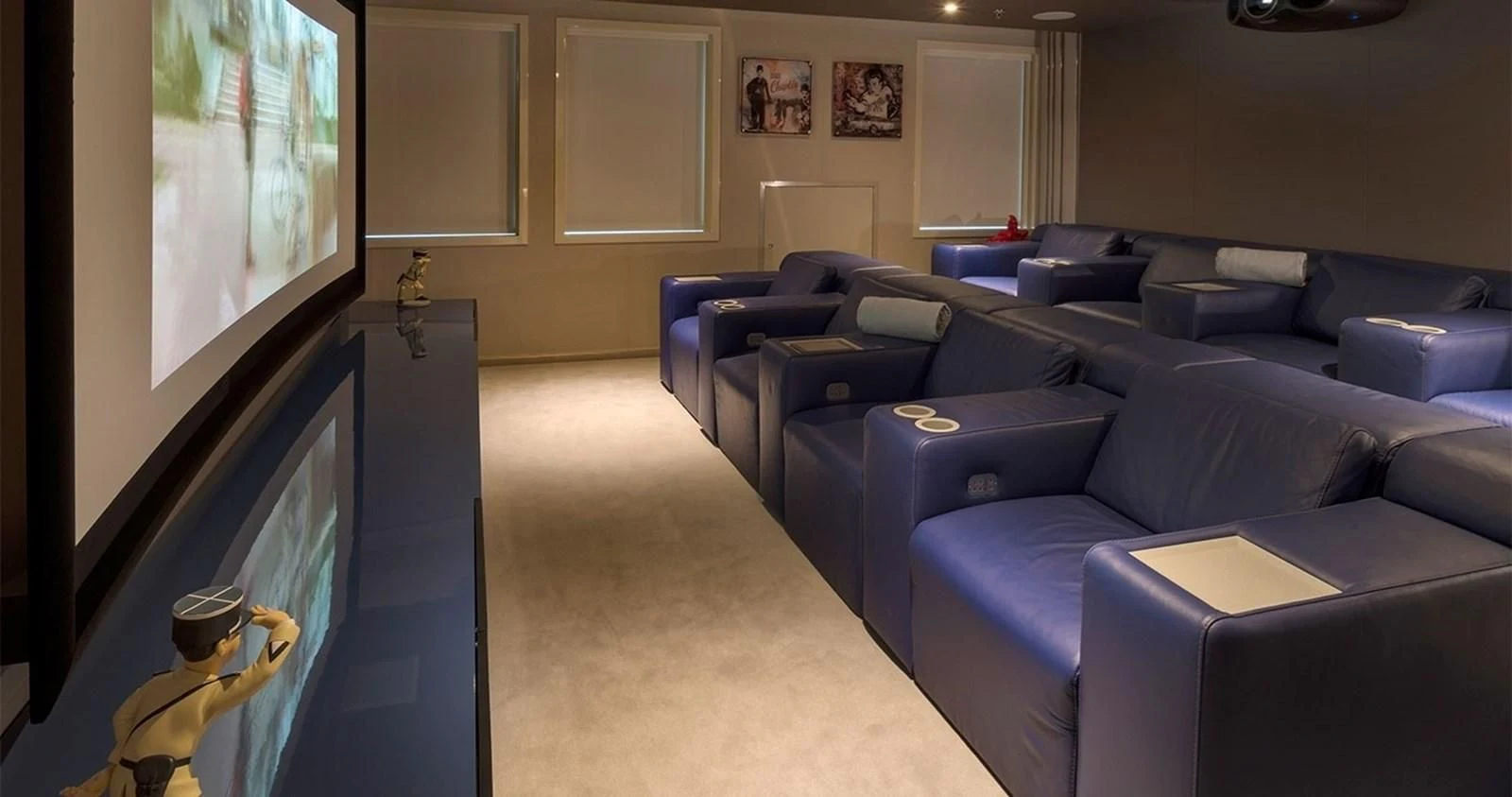 a living room with a large screen aboard MARQUISE Yacht for Sale