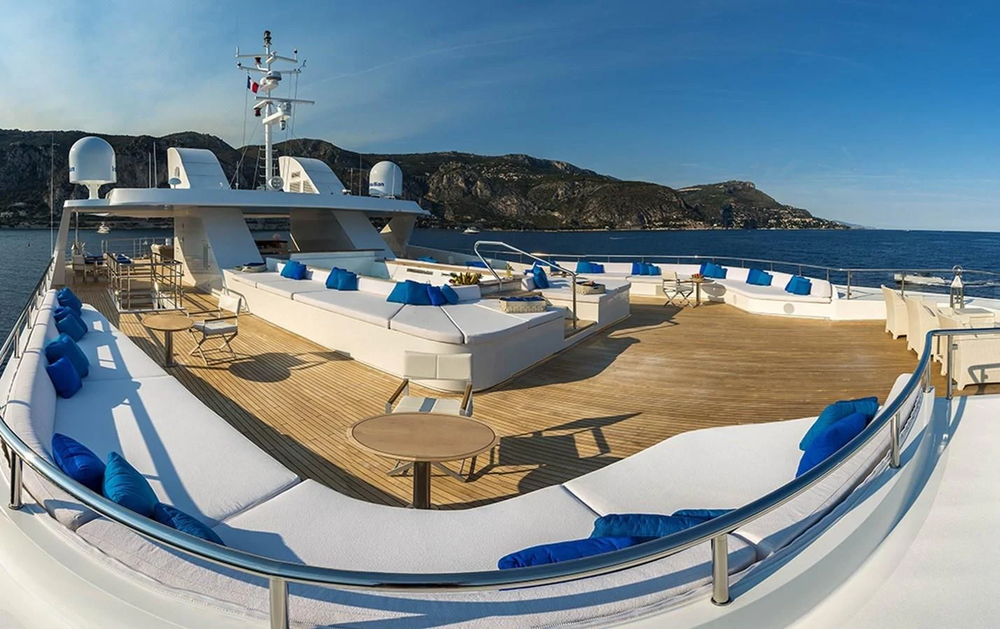 a deck with a table and chairs on it aboard MARQUISE Yacht for Sale