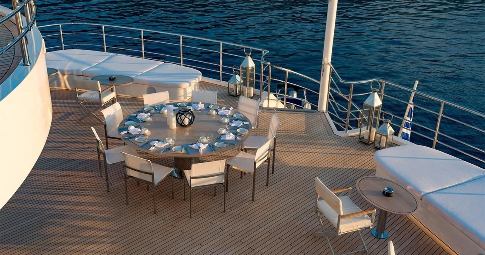 a deck with a table and chairs on it aboard MARQUISE Yacht for Sale