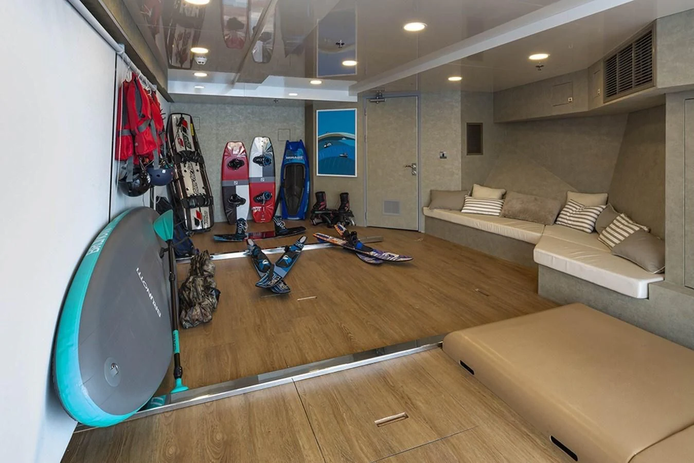 a room with a large rack of kayaks and a bed aboard MARQUISE Yacht for Sale