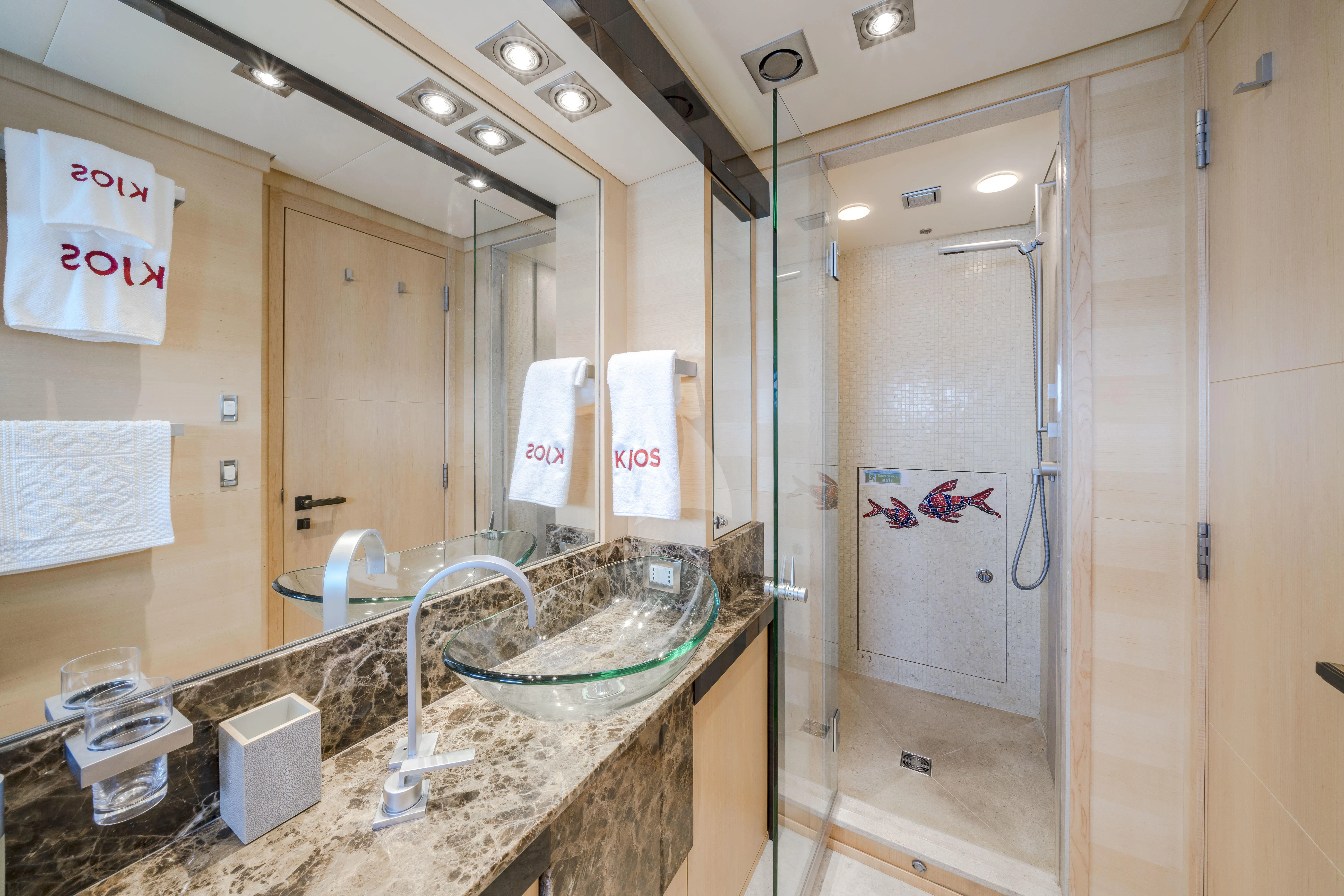 a bathroom with a large mirror aboard KJOS Yacht for Charter