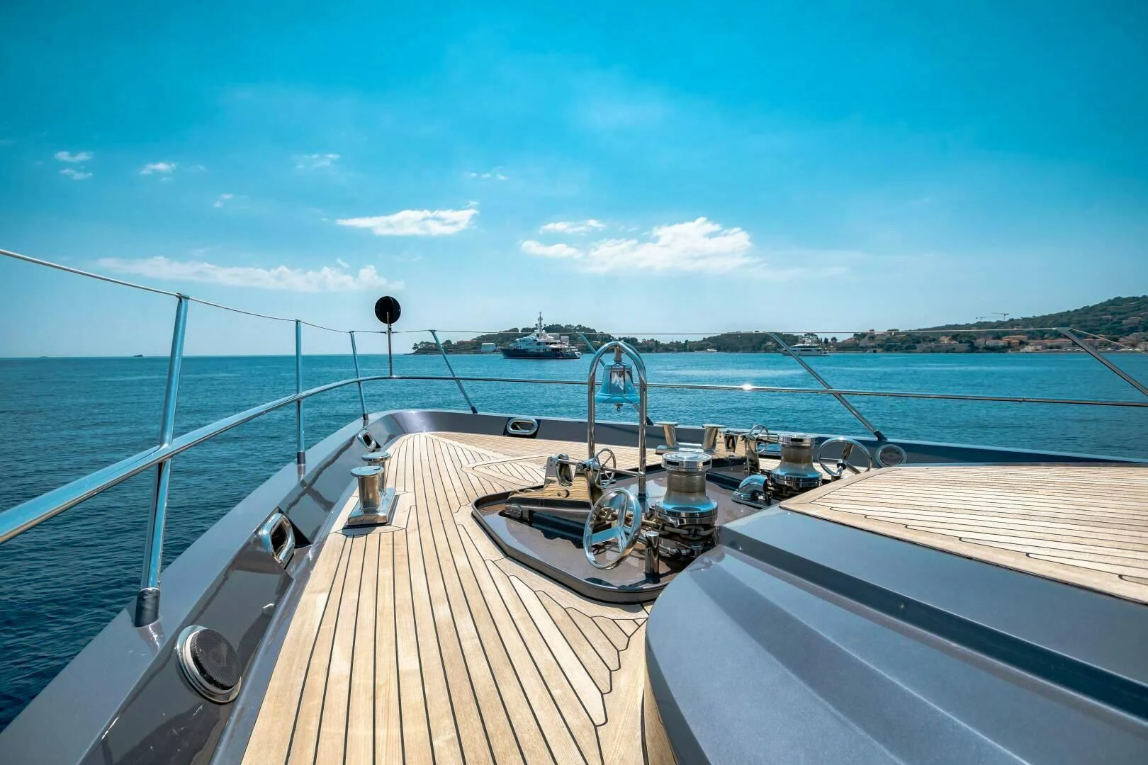 a deck with a deck and a view of the water aboard KJOS Yacht for Charter