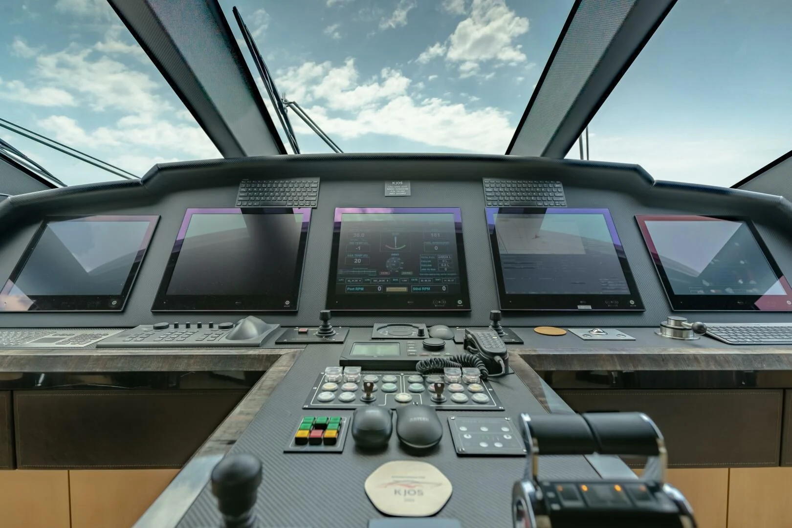 inside of a vehicle with computers aboard KJOS Yacht for Charter