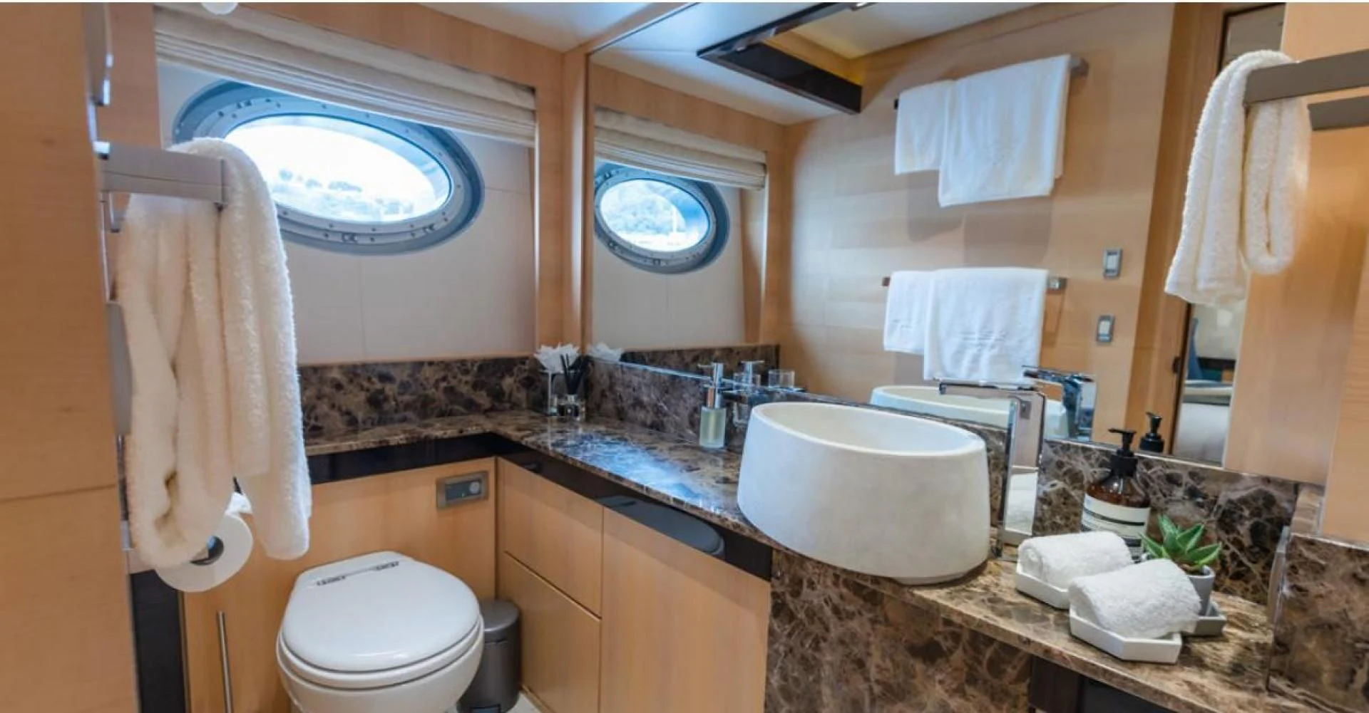 a bathroom with a large mirror aboard KJOS Yacht for Charter