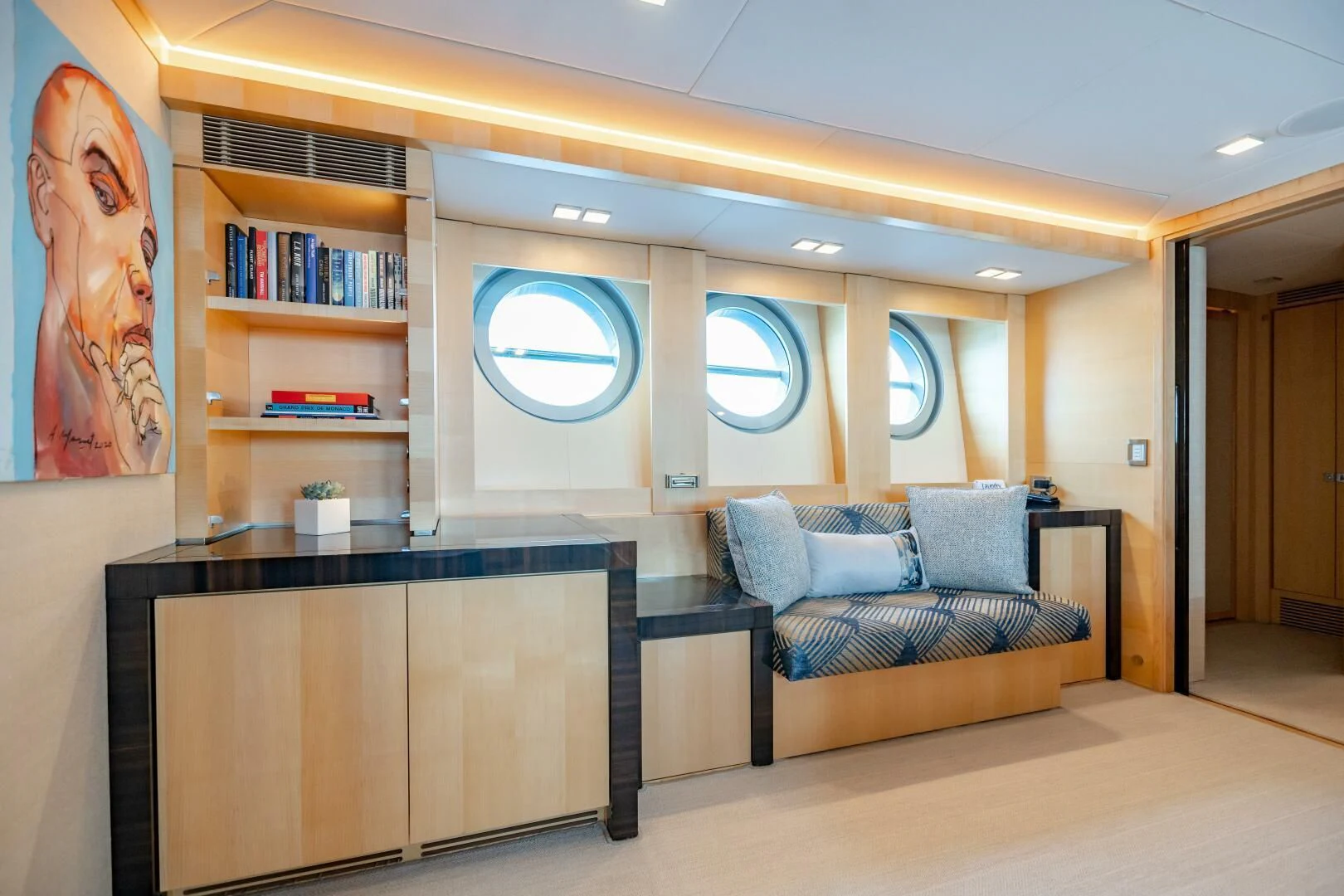 a living room with a couch and a tv aboard KJOS Yacht for Charter