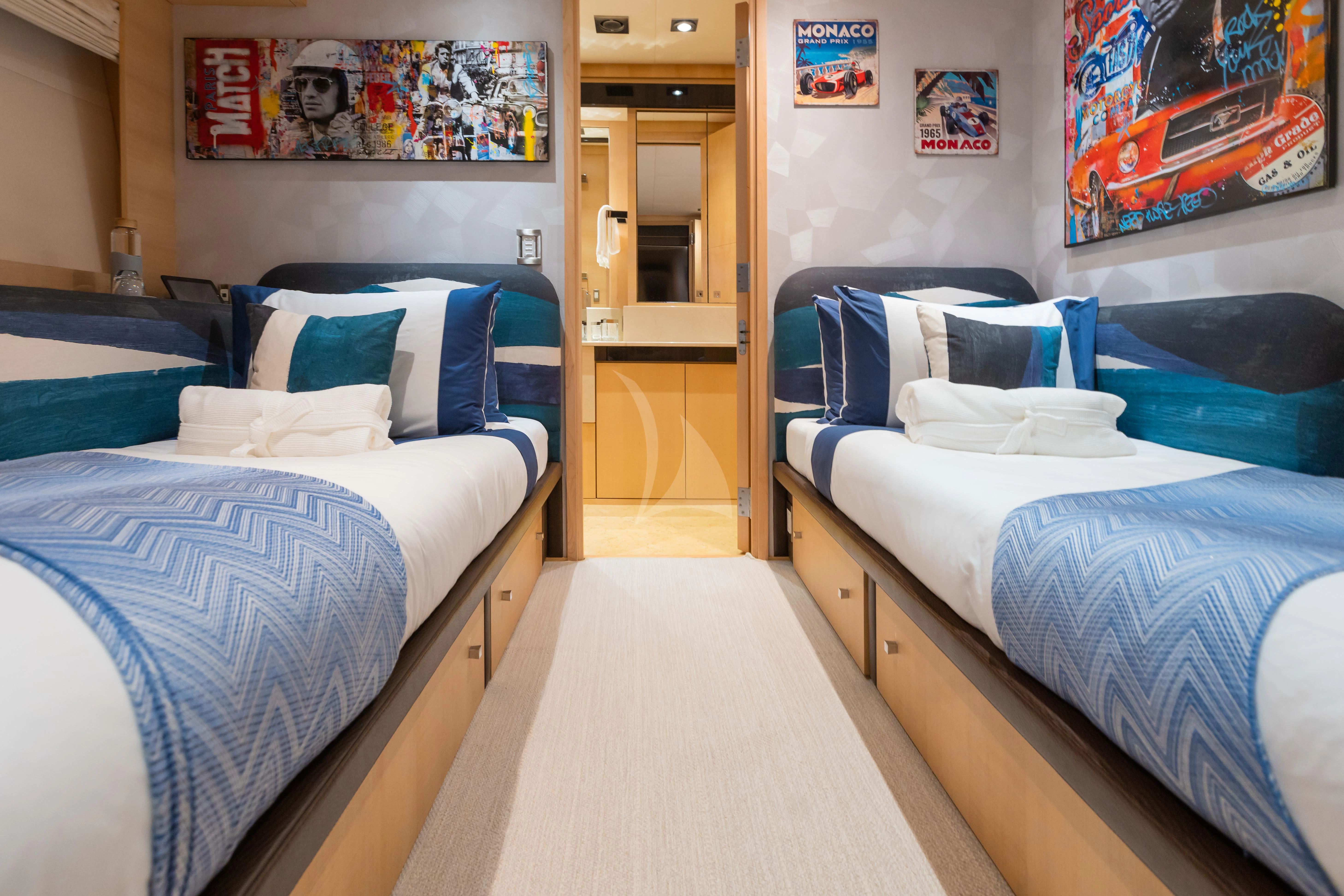 a room with two beds aboard KJOS Yacht for Charter