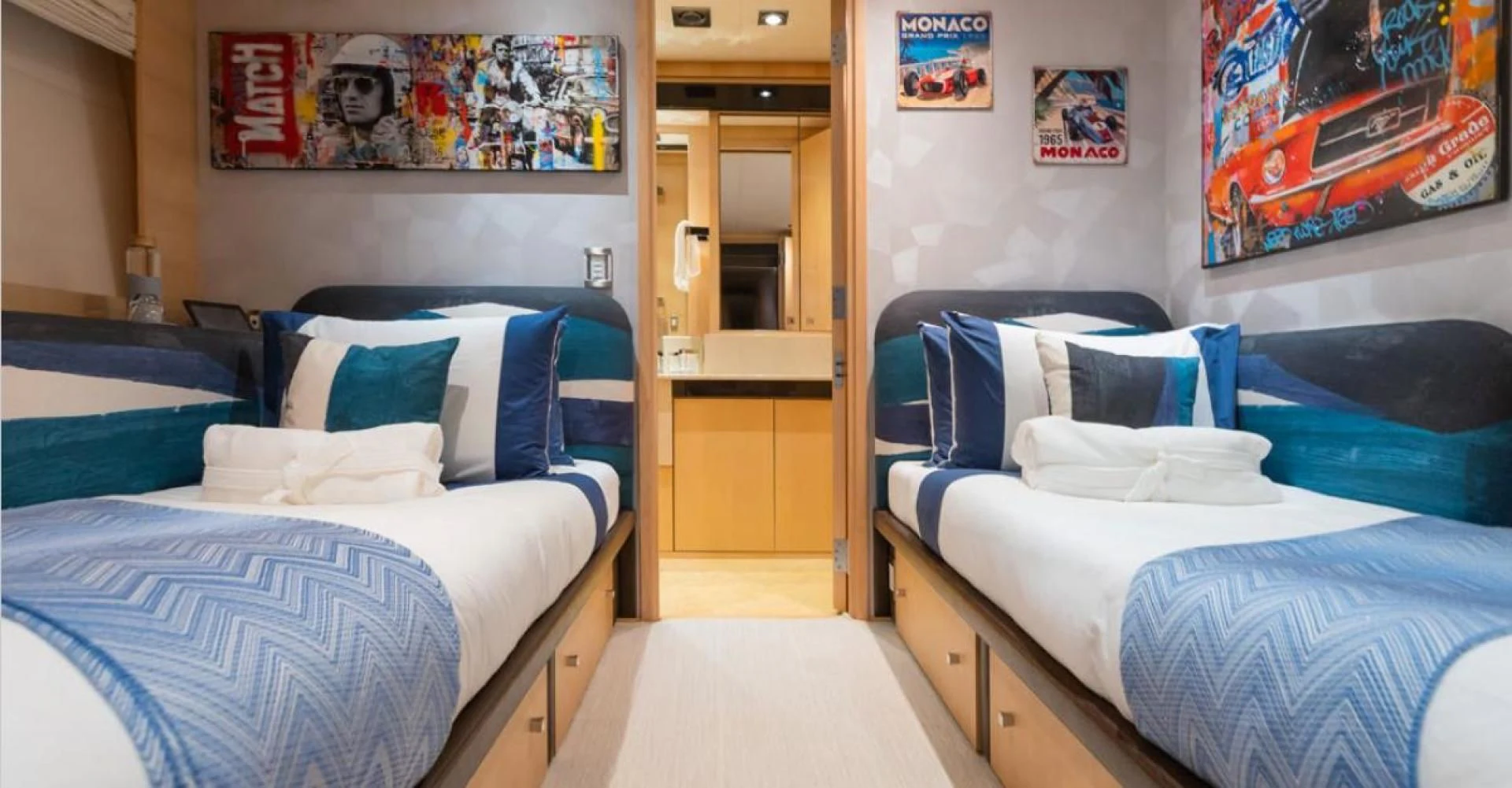 a room with two beds aboard KJOS Yacht for Charter