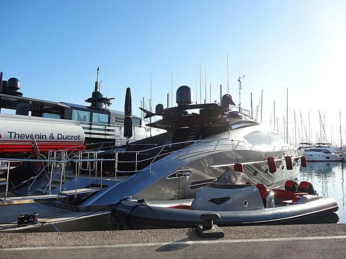 a boat parked on the pavement aboard KJOS Yacht for Charter