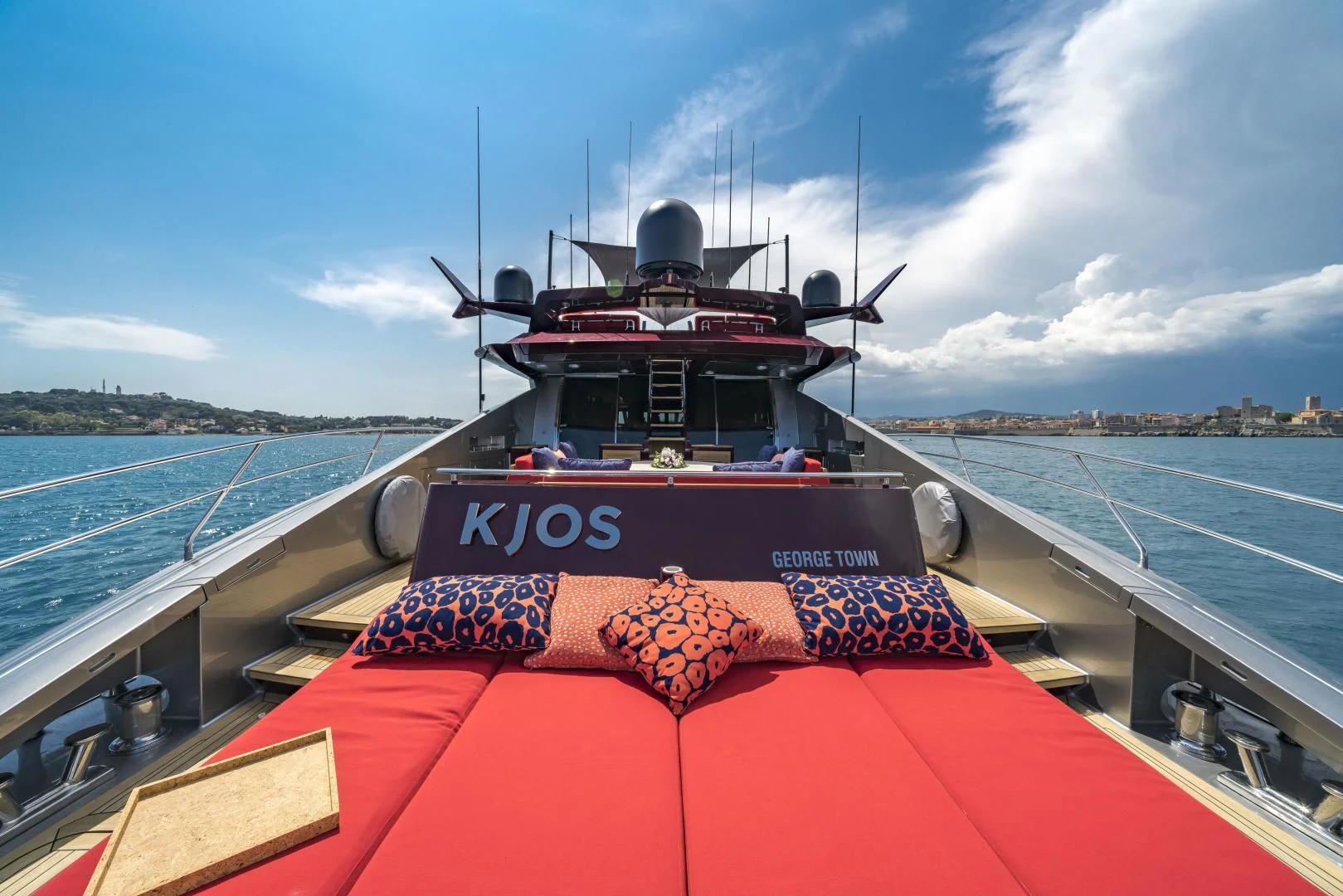 a boat on a water body aboard KJOS Yacht for Charter