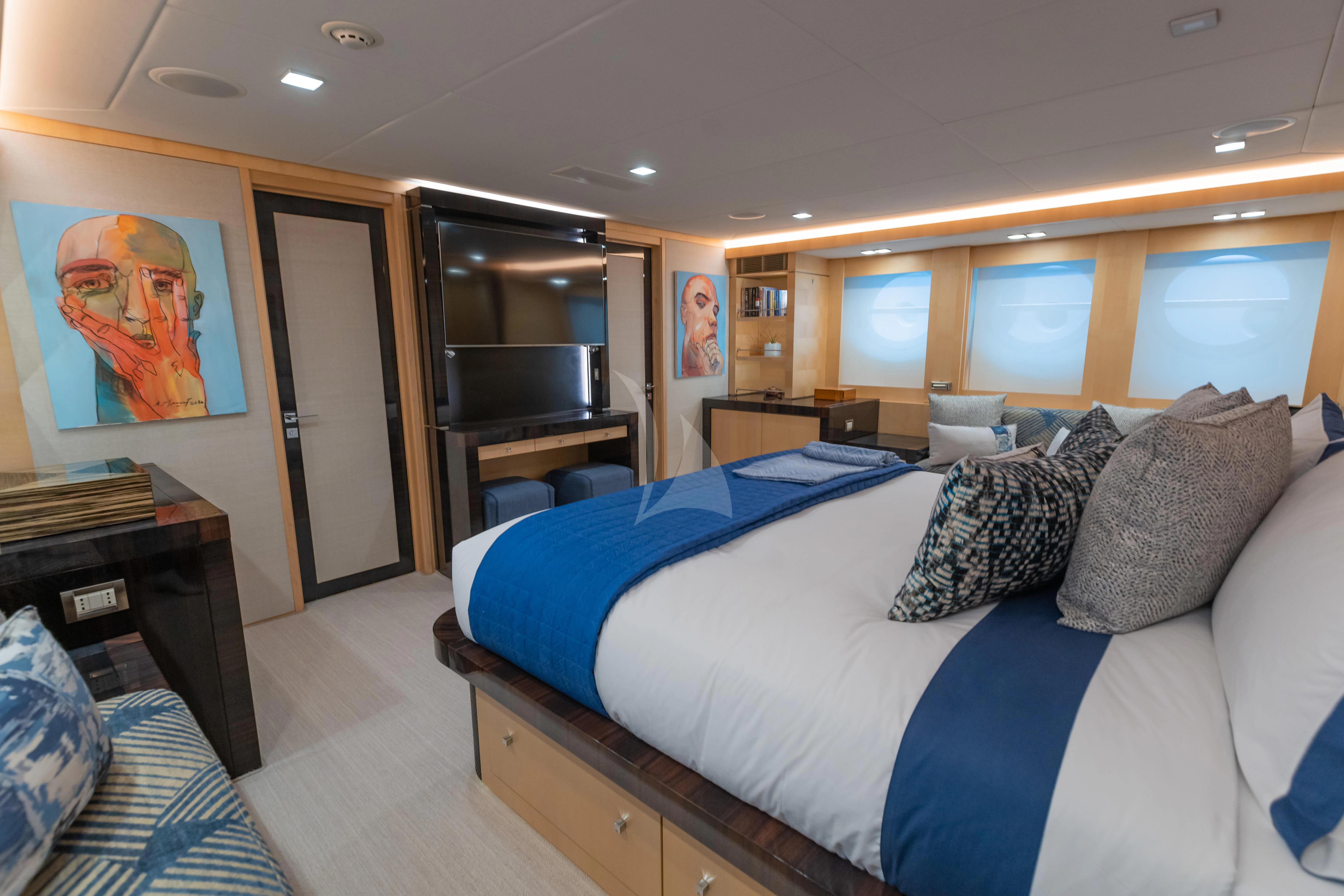 a bedroom with a large bed aboard KJOS Yacht for Charter