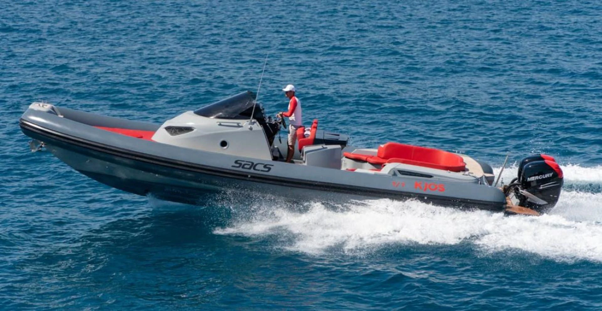 a man on a speed boat aboard KJOS Yacht for Charter