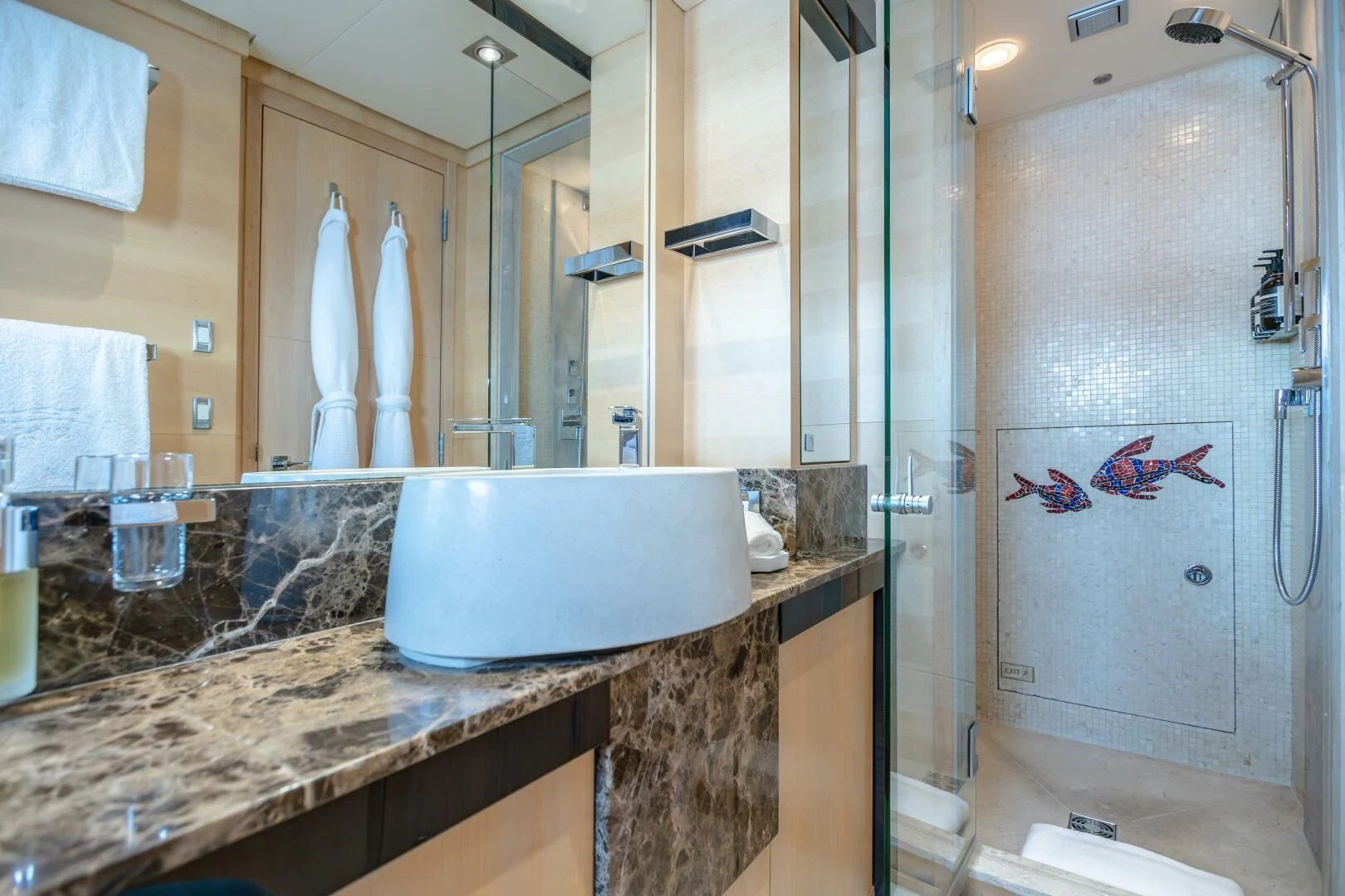 a bathroom with a large mirror aboard KJOS Yacht for Charter