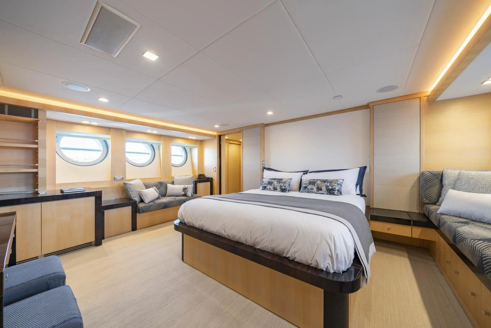 a bedroom with a bed and a couch aboard KJOS Yacht for Charter
