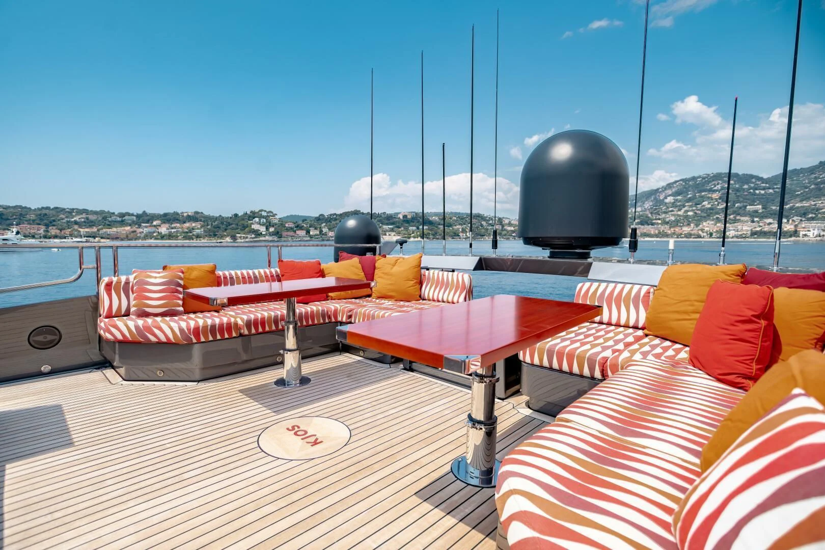 a deck with a large black ball on it and a large black ball on top of it aboard KJOS Yacht for Charter