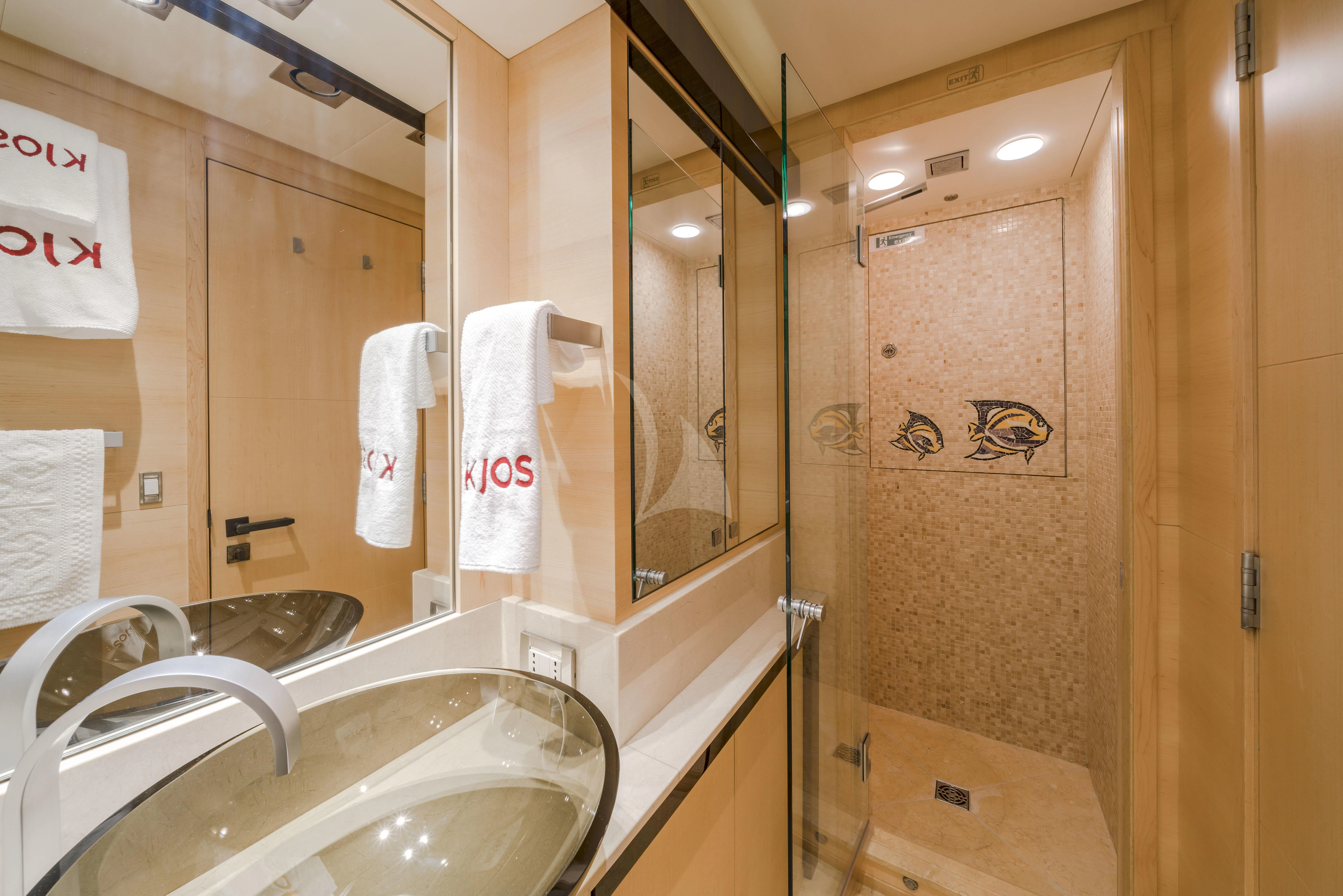 a bathroom with a large mirror aboard KJOS Yacht for Charter