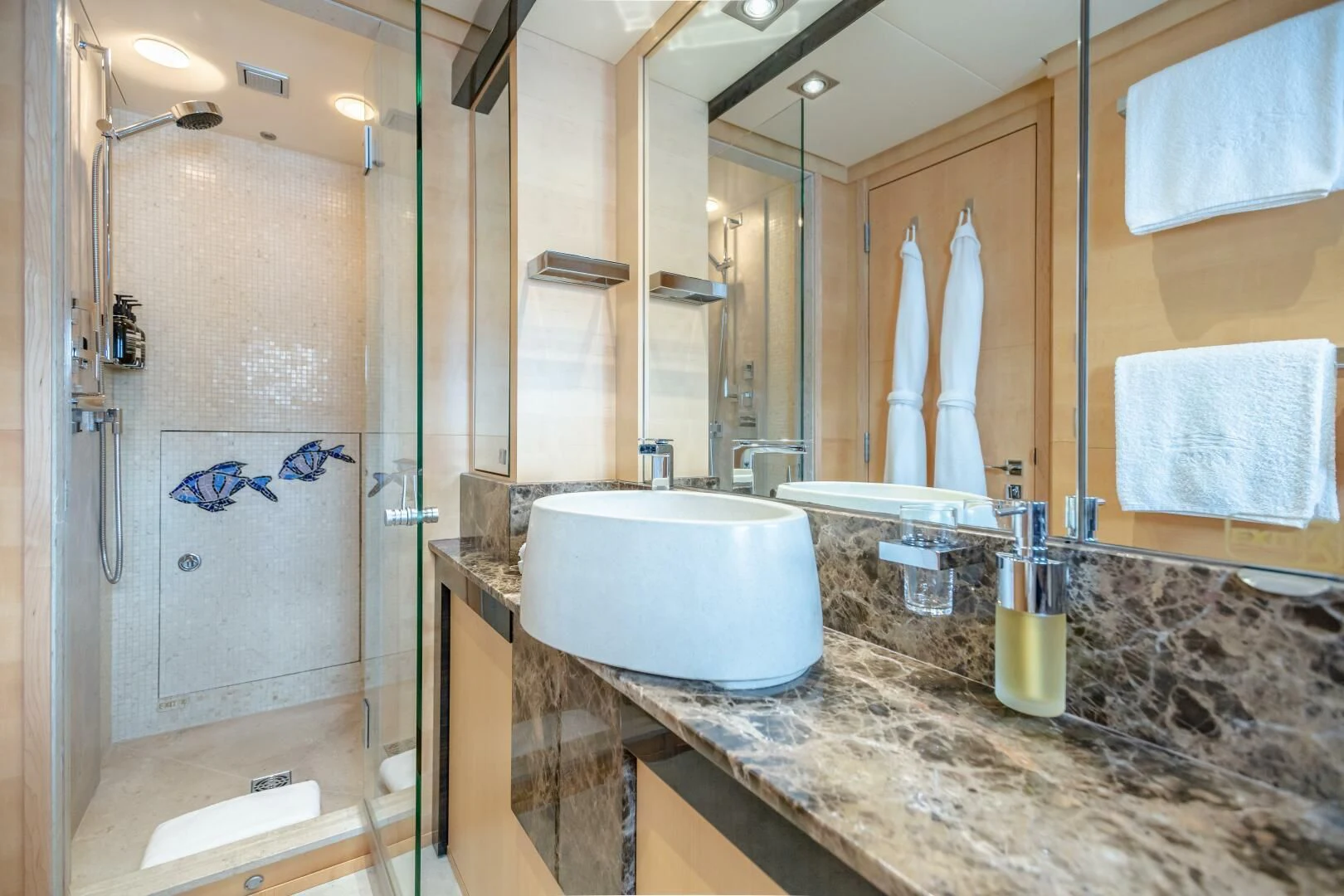 a bathroom with a large mirror aboard KJOS Yacht for Charter