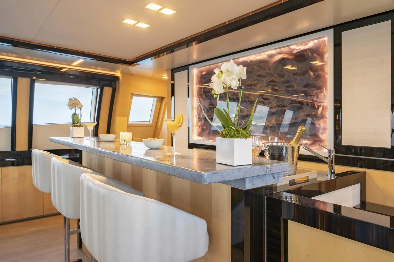 a table with a vase of flowers aboard KJOS Yacht for Charter