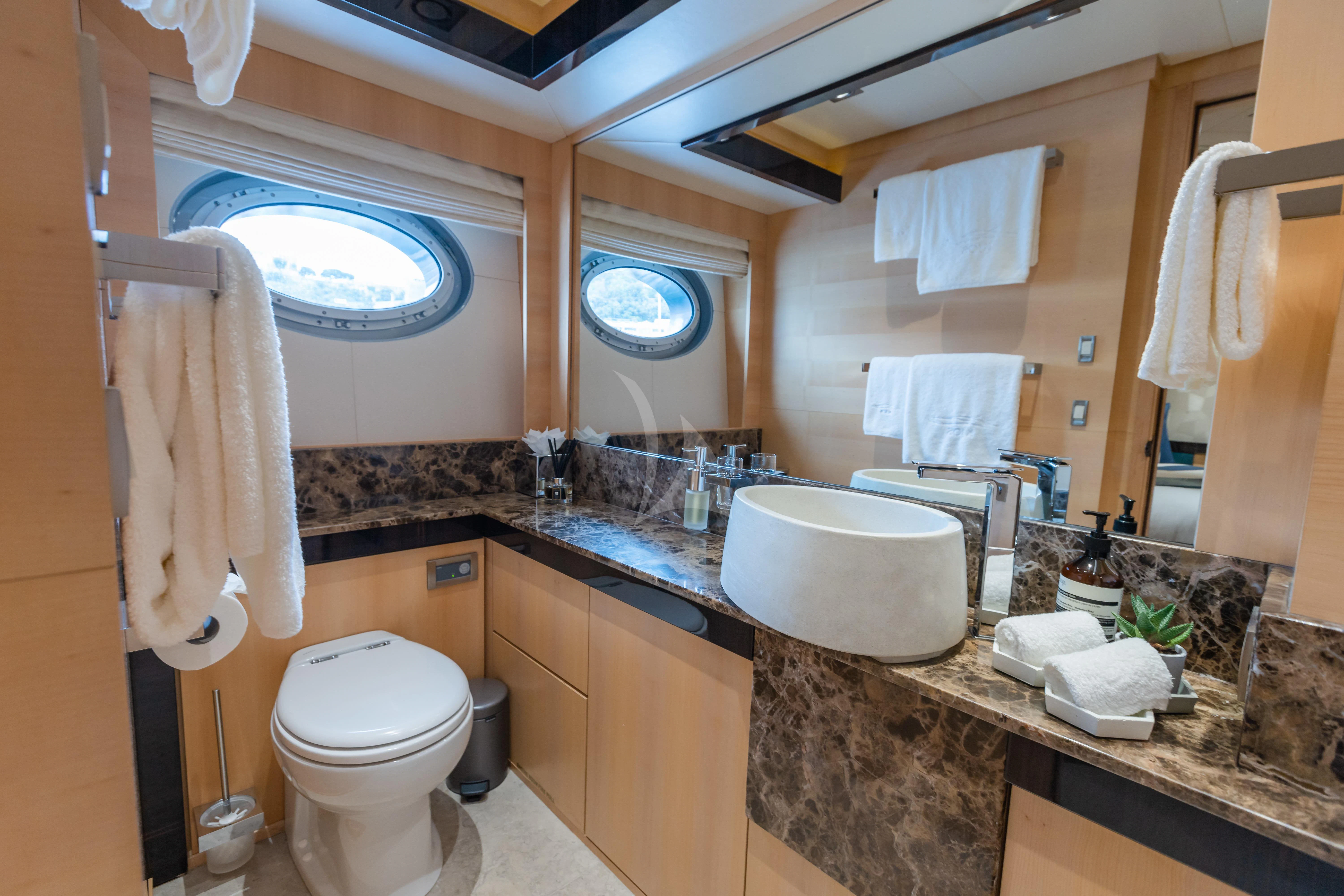 a bathroom with a marble countertop aboard KJOS Yacht for Charter