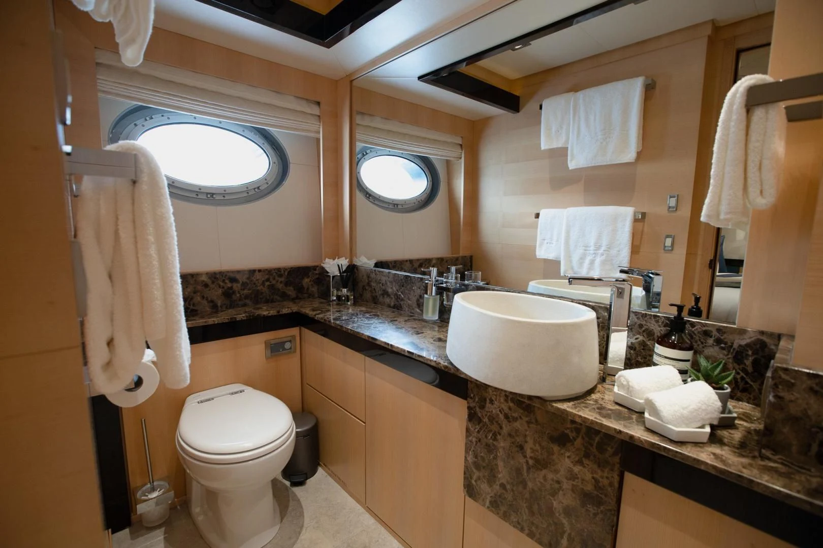 a bathroom with a large mirror aboard KJOS Yacht for Charter