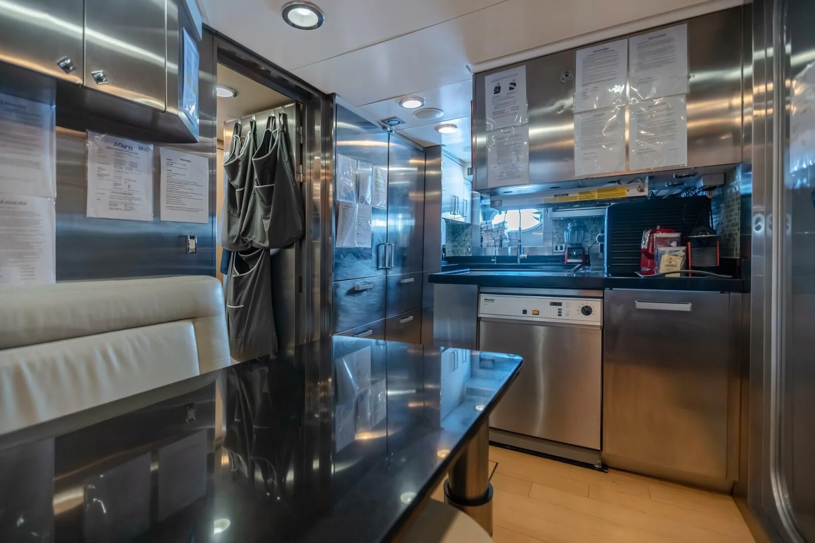 a large kitchen with glass walls aboard KJOS Yacht for Charter