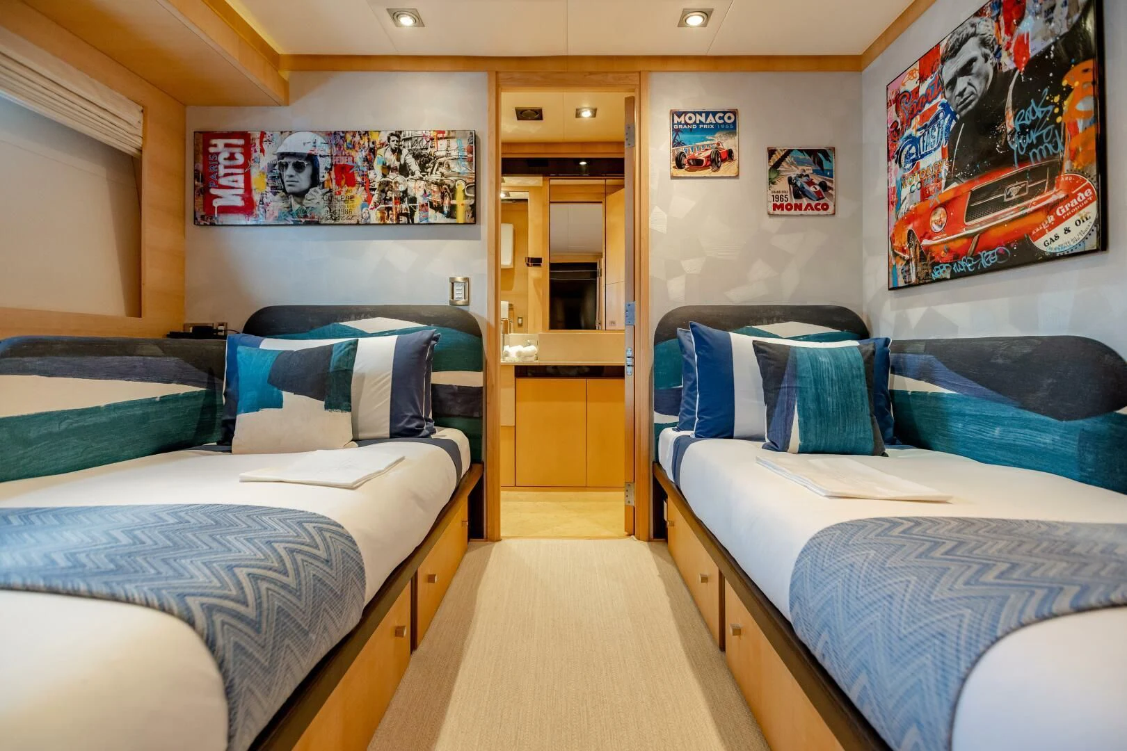 a couple of beds in a room aboard KJOS Yacht for Charter