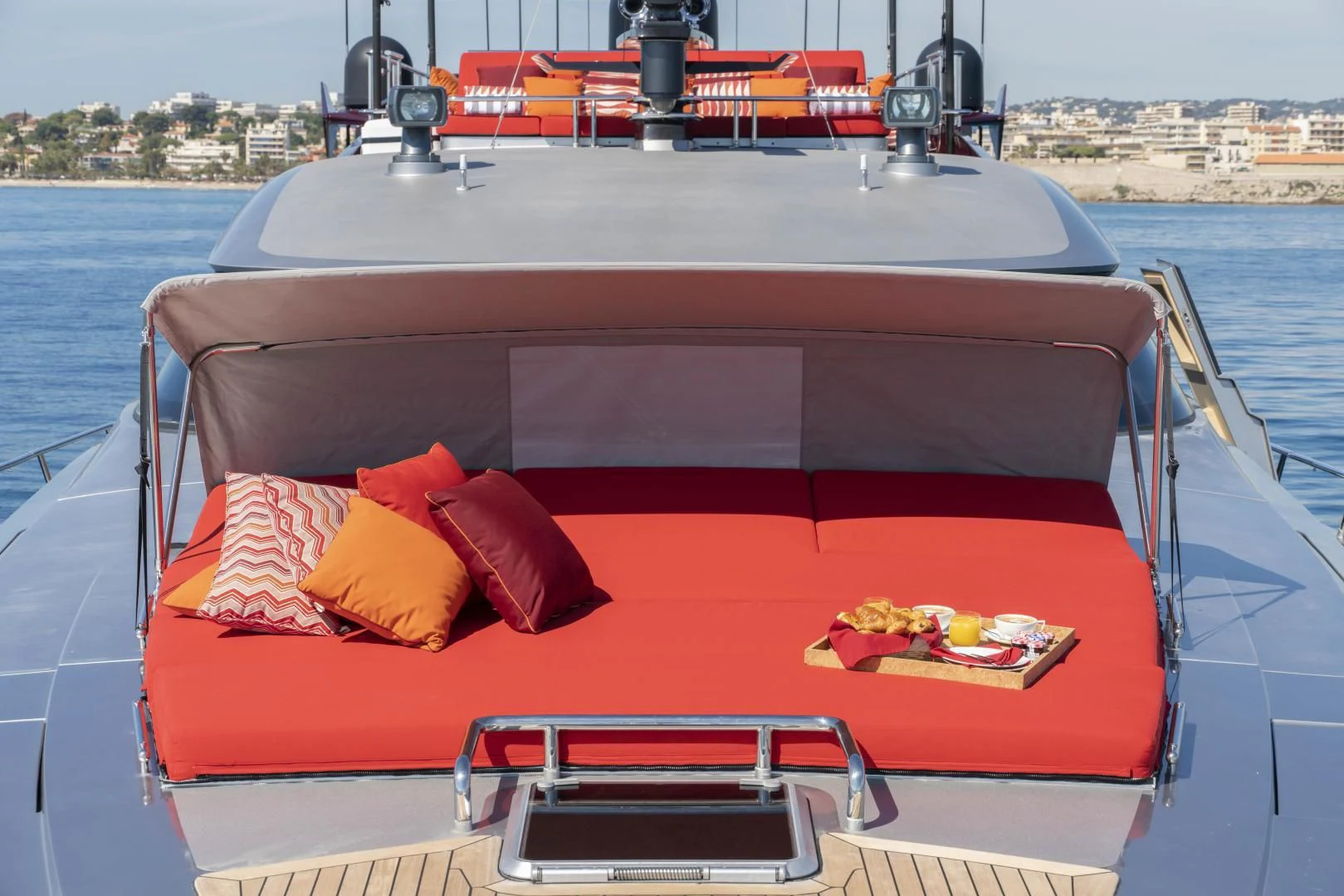 a boat with a tray of food on it aboard KJOS Yacht for Charter
