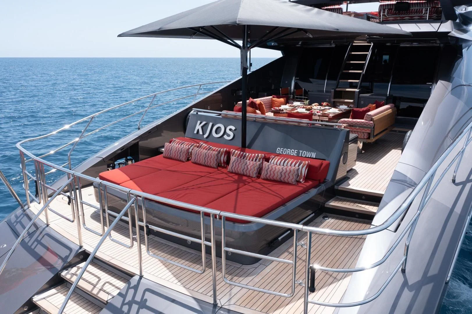 a boat with a table on it aboard KJOS Yacht for Charter
