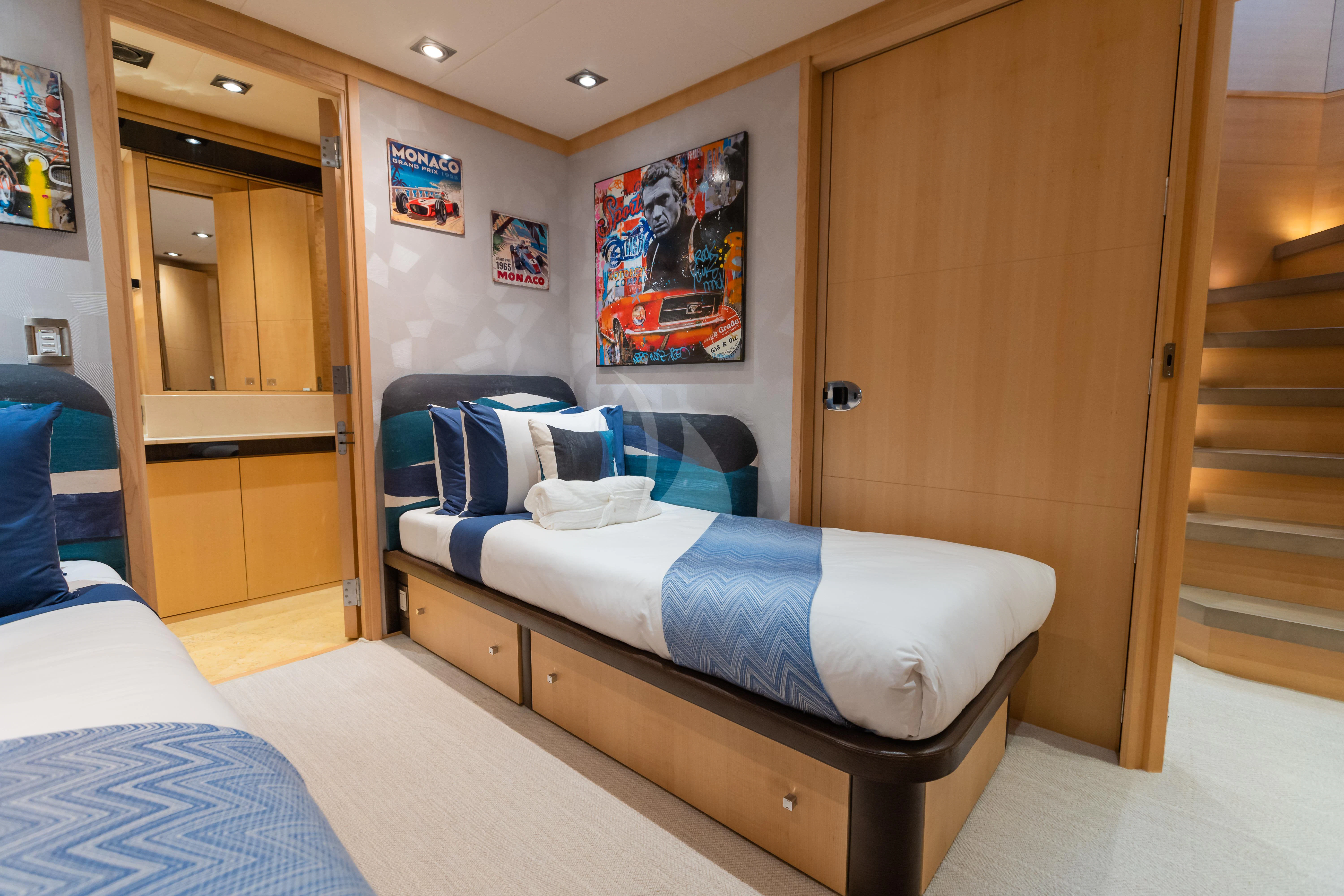a bedroom with a bed and a closet aboard KJOS Yacht for Charter