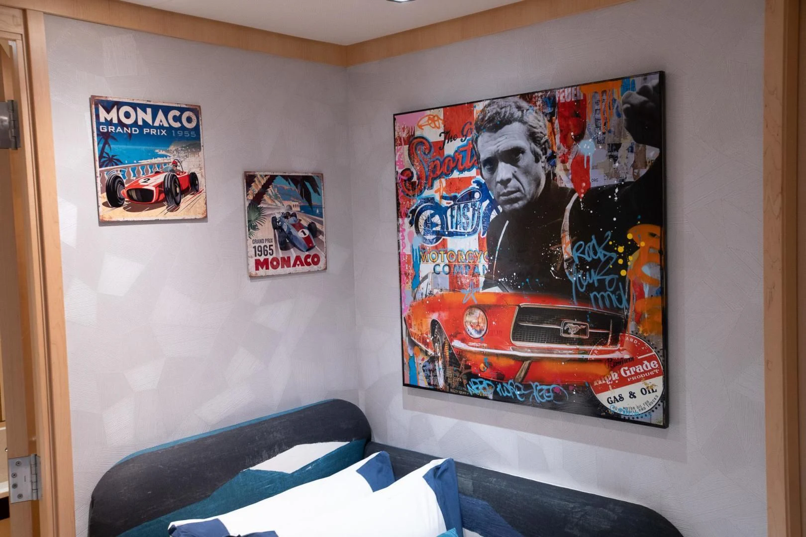 a wall with posters on it aboard KJOS Yacht for Charter