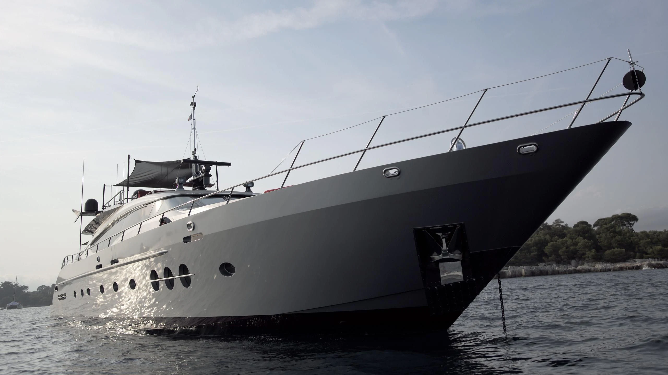 a large white boat in the water aboard KJOS Yacht for Charter