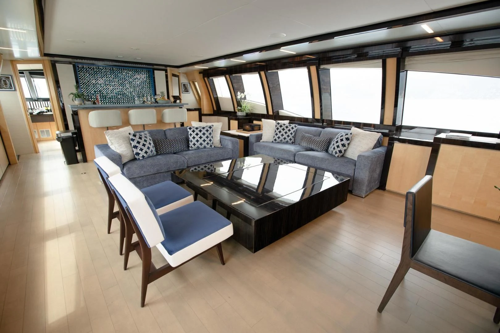 a living room with a couch and a coffee table aboard KJOS Yacht for Charter