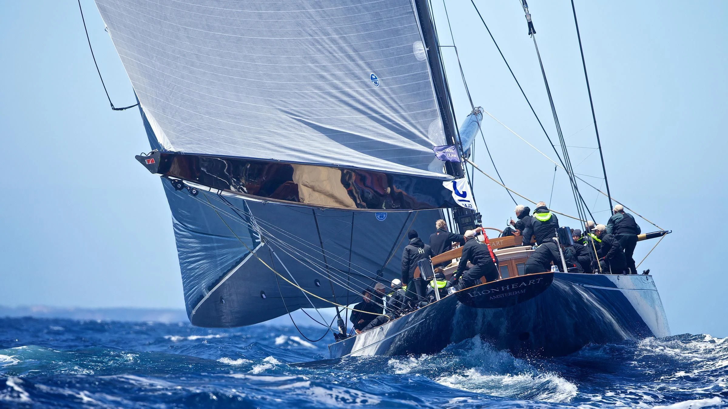 a group of people on a sailboat in the ocean aboard LIONHEART Yacht for Sale