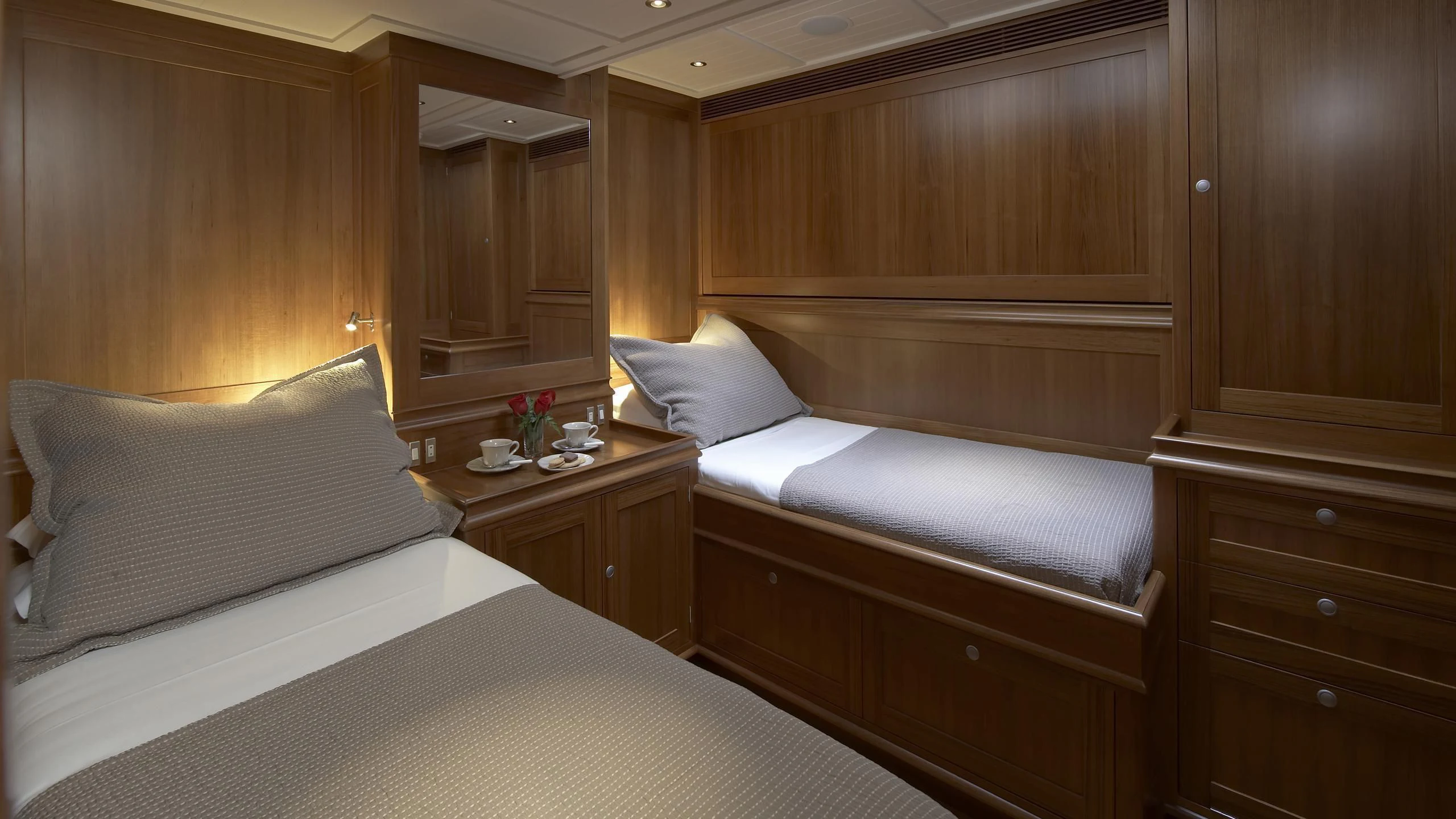 a room with a bed and a table aboard LIONHEART Yacht for Sale