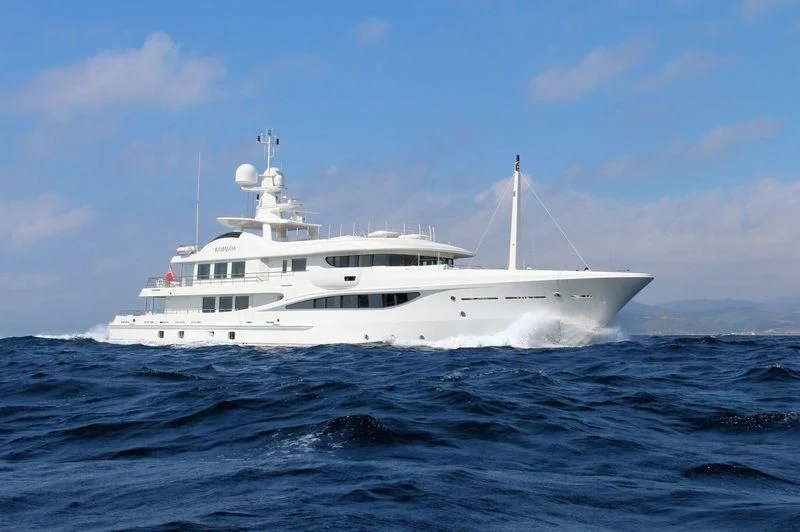 a white boat in the water aboard KAMALAYA Yacht for Sale