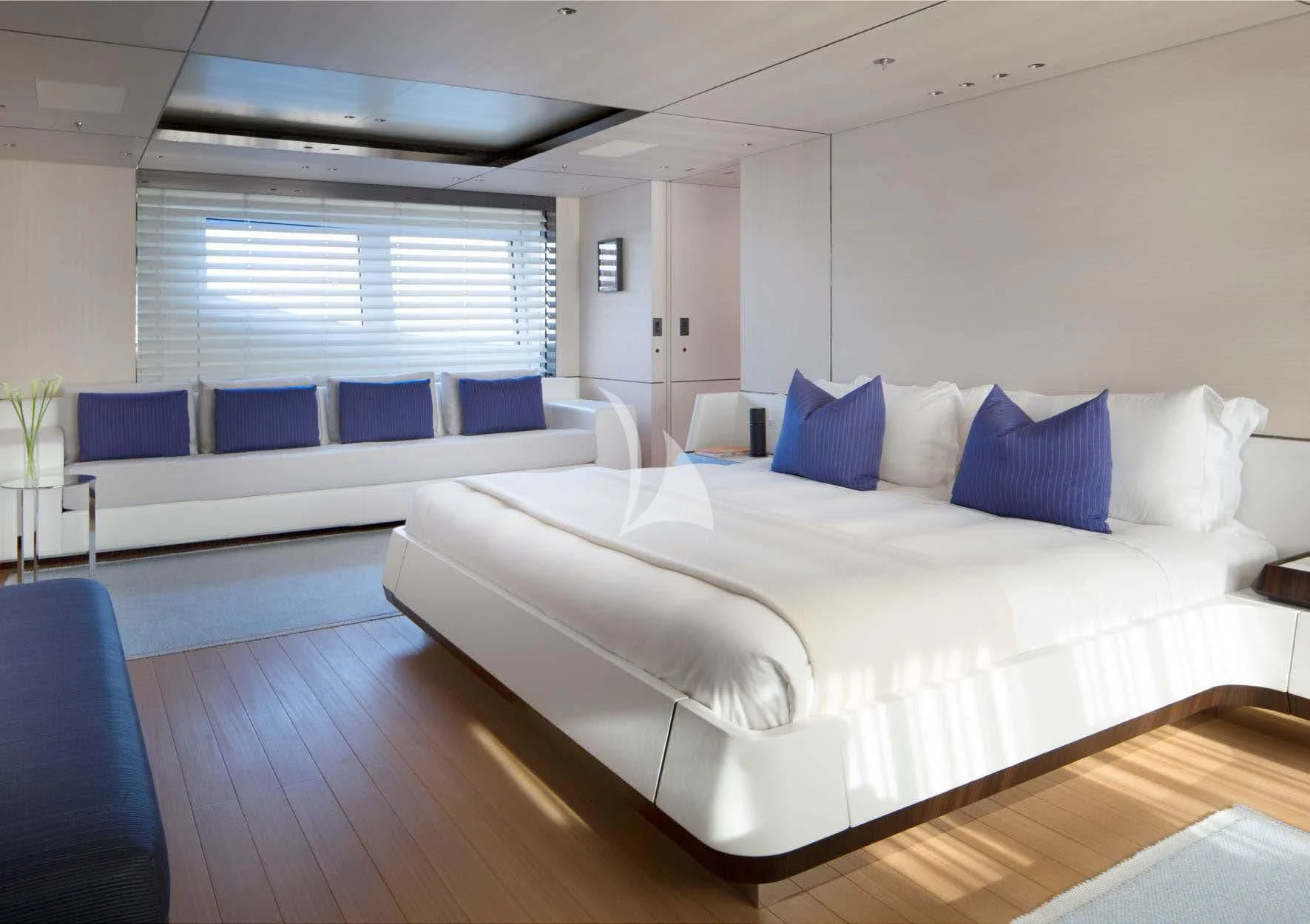 a room with a bed and a couch aboard KAMALAYA Yacht for Sale