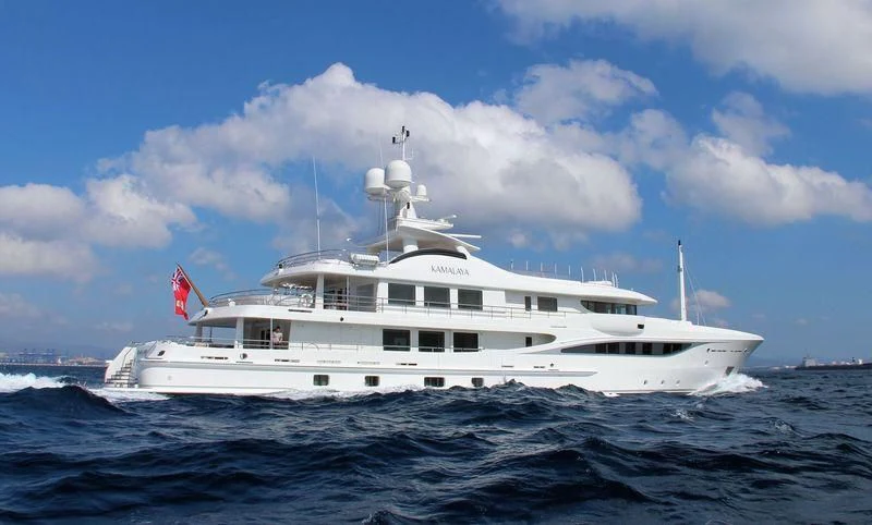 a large white boat in the water aboard KAMALAYA Yacht for Sale
