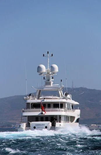 a large white ship with a satellite dish on top of it aboard KAMALAYA Yacht for Sale